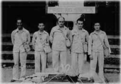 Interviewee Hisao Kimura, second from left, and other first aid squad members, stand in front of the Waimea First Aid Station, ca. 1942. (Photo courtesy Kimura family.)